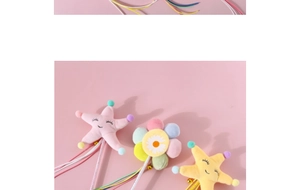 Detail of plush cat wand toys featuring colorful stars, flowers and jingling bells