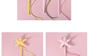 Detail of plush starfish cat wand with colorful ropes and embroidery in yellow and pink