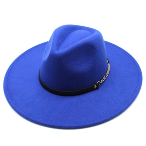 Detailed top view of a royal blue wool fedora with a black band and gold chain accent