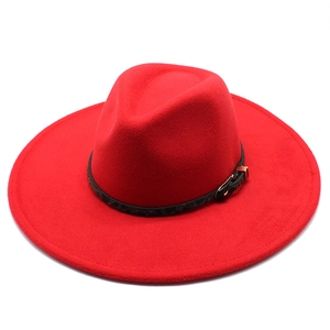 Detail of red wool felt fedora featuring a leopard print band and golden buckle