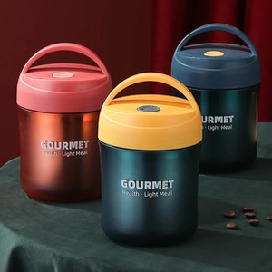 Three multi-colored insulated stainless steel soup mugs with handles on a staged display