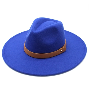 Detail of royal blue wool fedora with brown leather band and gold stud accent