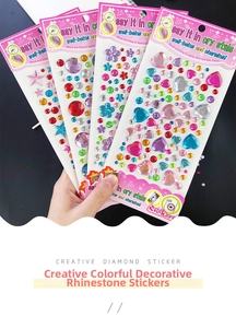 Close-up of DIY colorful crystal stickers featuring hearts stars and floral shapes