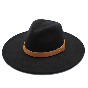 Detail of wool fedora hat featuring brown leather band and gold rivet accents