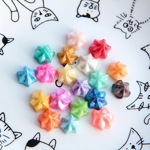 Close-up of pearl-textured colorful star shapes for DIY cream glue craft decoration