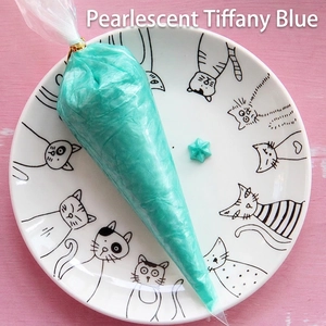 Pearly Tiffany Blue DIY cream glue in a piping bag for handmade phone cases