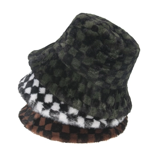 Stack of three plush checkered bucket hats in green, black, and brown faux fur textures