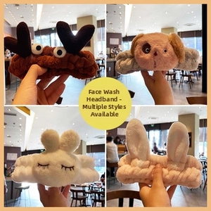 Close-up of assorted plush cartoon animal headbands including reindeer and rabbit styles