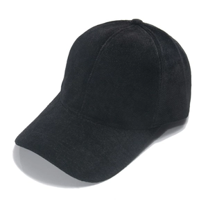 Close-up of black faux mink baseball cap showing soft fuzzy texture and solid color