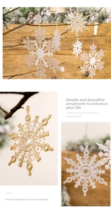 Detailed close-up of sparkling white and gold snowflake ornaments with glitter finish