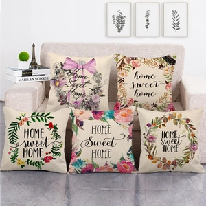Set of five linen pillows featuring vintage floral wreaths and Home Sweet Home text