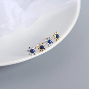 Close-up of S925 silver stud earrings with round blue lapis lazuli in gold and silver finish