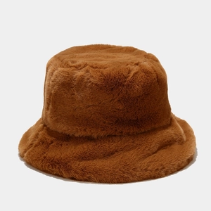 Detail of warm brown plush bucket hat showing thick faux fur texture and soft material