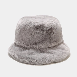 Close-up of soft light grey faux rabbit fur texture on a thick winter bucket hat