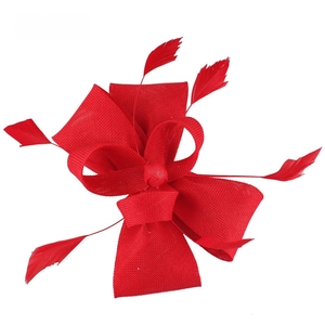 Detailed view of red Sinamay fascinator hat with elegant bow and feather accents