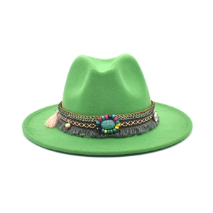 Detail of green felt fedora hat with ethnic woven band, turquoise stone and grey tassels