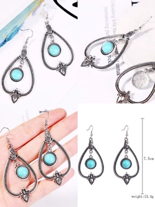 Detailed views of 7.5cm bohemian silver teardrop earrings with turquoise stones
