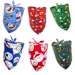 Detail view showing a variety of Christmas themed cotton bandanas for dogs in multiple patterns