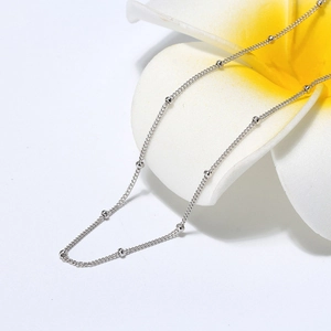 Minimalist S925 sterling silver beaded cable chain necklace on a frangipani flower