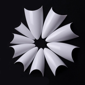 French stiletto nail tips set in white finish arranged in a circular radial layout