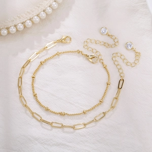 Elegant gold double-layered paperclip chain bracelet set with sparkling zircon drops