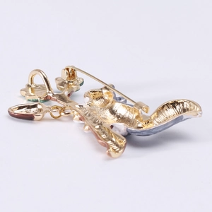 Cute enamel squirrel brooch on a branch made of gold-plated alloy with pin closure