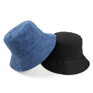 Detail of navy and black bucket hats showing textured fabric and reinforced brim stitching