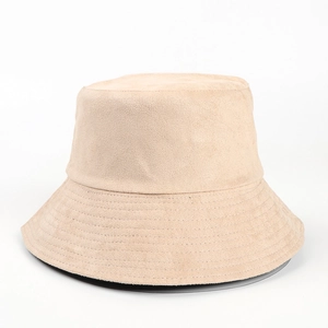 Detail showing the fine suede texture and reinforced stitching on the beige bucket hat brim