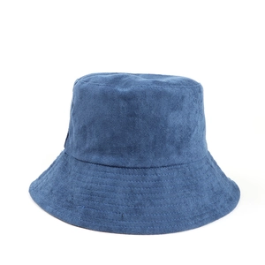 Close-up of dark blue faux suede bucket hat showing fine fabric texture and neat stitching