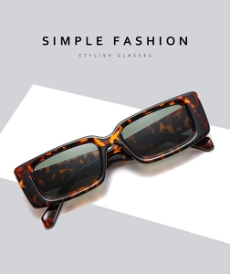 Detail of tortoise shell square sunglasses frame with dark lenses and retro style