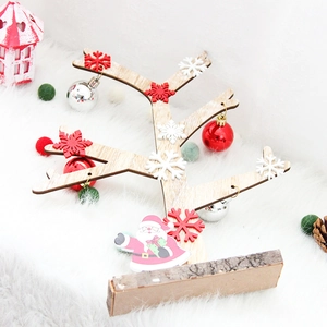 Mini wooden Christmas tree ornament with festive red snowflake and Santa Claus decor