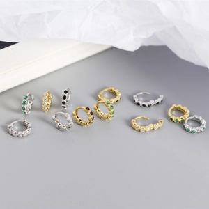 Detailed view of S925 sterling silver huggie earrings with colorful zircon pavé settings