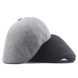 Classic wool felt newsboy caps in black and light grey for men and women during winter