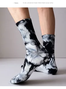 Macro shot of breathable tie-dye cotton socks showing fabric texture and snug fit