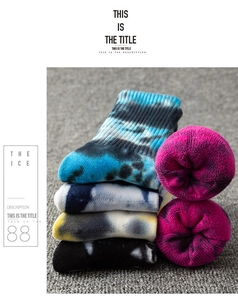 Detail of thick tie-dye crew socks featuring warm terry lining and vibrant gradient colors