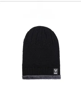 Detail showing thick fleece lining and V SPORTS patch on black knitted winter beanie