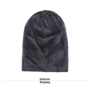 Detailed view of the thick dark grey plush lining of the warm winter knitted beanie hat