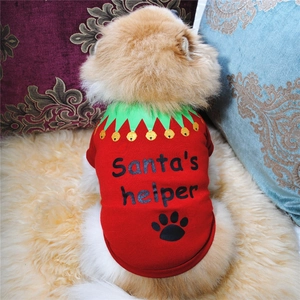 Detail of red Christmas dog T-shirt featuring Santa's Helper text and festive bells