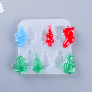 Detailed view of translucent silicone Christmas molds and colorful resin holiday crafts