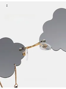Detail of cloud-shaped rimless sunglasses featuring comfortable silicone nose pads