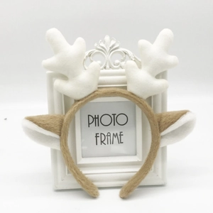 Cute plush giraffe and reindeer antler headband featuring brown ears and white horns