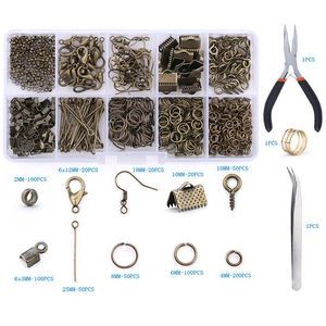 Detail of DIY jewelry making kit with bronze metal charms, tools, and precise size labels