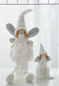 Detailed view of plush angel dolls with sequin wings and soft white feathers