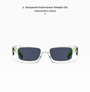 Close-up of retro square sunglasses with transparent frames and neon green temple tips