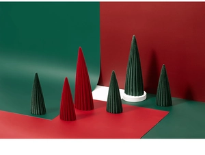 Close-up of ceramic flocked Christmas trees with elegant vertical ribbed textures