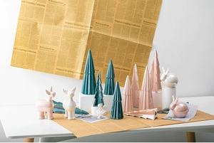 Ceramic Christmas tree and reindeer figurines set in green and pink for holiday table decor