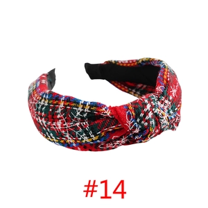 Detail of red and green plaid headband with retro knot design and anti-slip lining