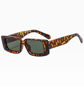 Detail view of vintage rectangle sunglasses with tortoise frame and dark green lenses