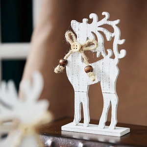 Rustic white wooden Christmas reindeer decoration with jute bow and beads on a stand