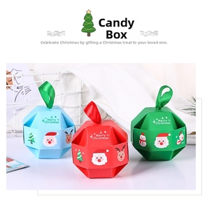 Close-up of geometric Christmas candy boxes with silk handles and festive patterns